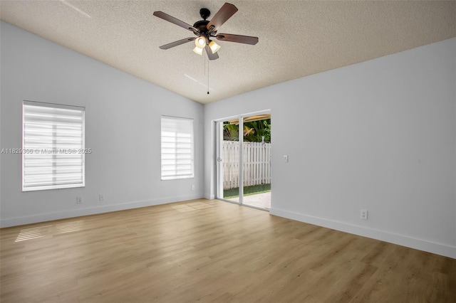 1611 Palermo Dr, Weston, FL 33327 - spare room featuring a textured ceiling, lofted ceiling, a ceiling fan, and light wood-type flooring