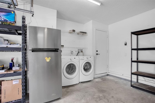 1611 Palermo Dr, Weston, FL 33327 - laundry room featuring washer and dryer and a textured ceiling