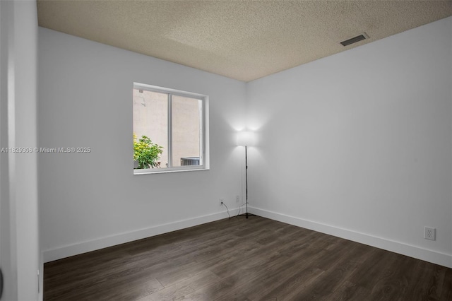1611 Palermo Dr, Weston, FL 33327 - spare room featuring dark wood-style flooring and a textured ceiling