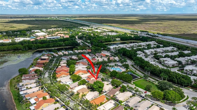 1611 Palermo Dr, Weston, FL 33327 - aerial view of property and surrounding area featuring nearby suburban area and a large body of water