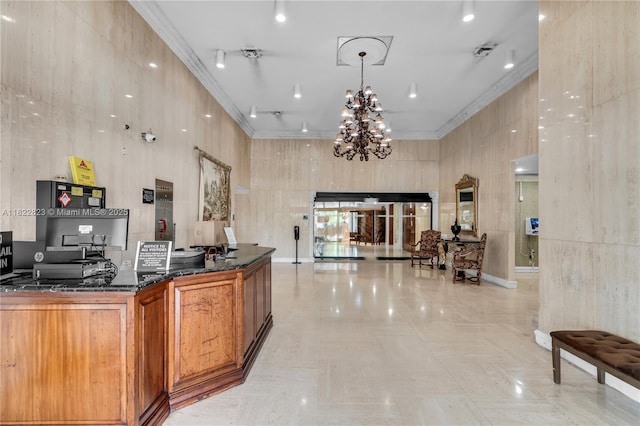 600 Three Islands Blvd Unit 310, Hallandale Beach, FL 33009 - reception area with a chandelier, ornamental molding, and a high ceiling
