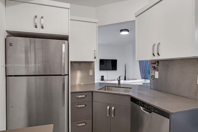 747 Michigan Ave Unit 201, Miami Beach, FL 33139 - kitchen featuring stainless steel appliances, white cabinetry, and light countertops