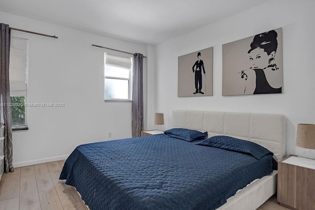 747 Michigan Ave Unit 201, Miami Beach, FL 33139 - bedroom featuring wood finished floors and baseboards