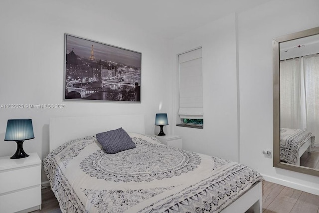 747 Michigan Ave Unit 201, Miami Beach, FL 33139 - bedroom featuring wood finished floors and baseboards