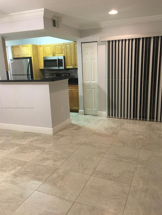 10670 SW 156th Pl Unit 309, Miami, FL 33196 - kitchen with stainless steel appliances, ornamental molding, dark countertops, light tile patterned floors, and decorative backsplash