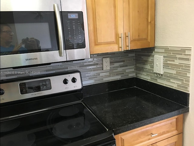10670 SW 156th Pl Unit 309, Miami, FL 33196 - kitchen with stainless steel appliances, backsplash, and light brown cabinetry