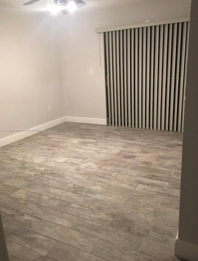 10670 SW 156th Pl Unit 309, Miami, FL 33196 - spare room featuring a ceiling fan and wood finished floors