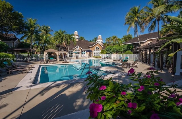 10670 SW 156th Pl Unit 309, Miami, FL 33196 - community pool featuring a patio area, a gazebo, and a pergola