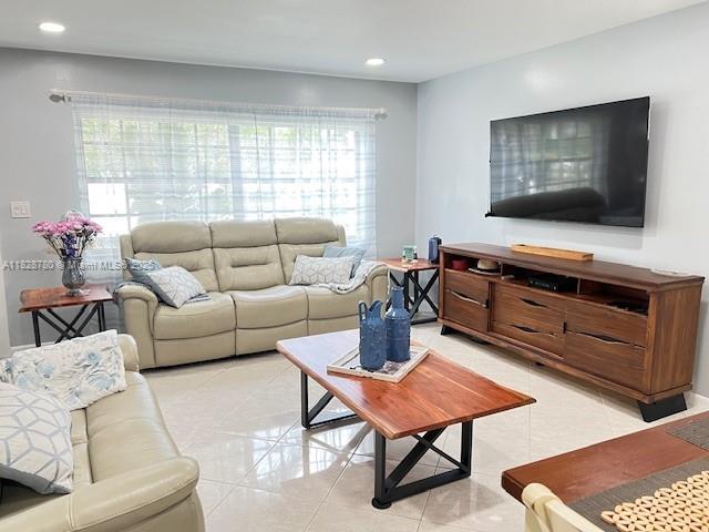 905 NW 107th Ave, Pembroke Pines, FL 33026 - living room featuring healthy amount of natural light, light tile patterned floors, and recessed lighting