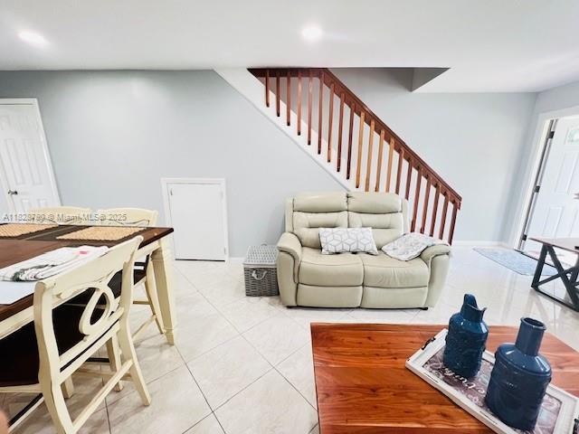 905 NW 107th Ave, Pembroke Pines, FL 33026 - living area with stairway and light tile patterned floors