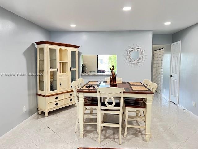 905 NW 107th Ave, Pembroke Pines, FL 33026 - dining area with recessed lighting and light tile patterned flooring