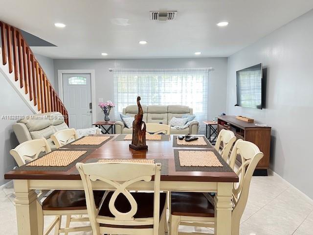 905 NW 107th Ave, Pembroke Pines, FL 33026 - dining space featuring stairs, plenty of natural light, light tile patterned flooring, and recessed lighting