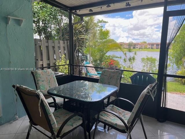 905 NW 107th Ave, Pembroke Pines, FL 33026 - sunroom with a water view and plenty of natural light