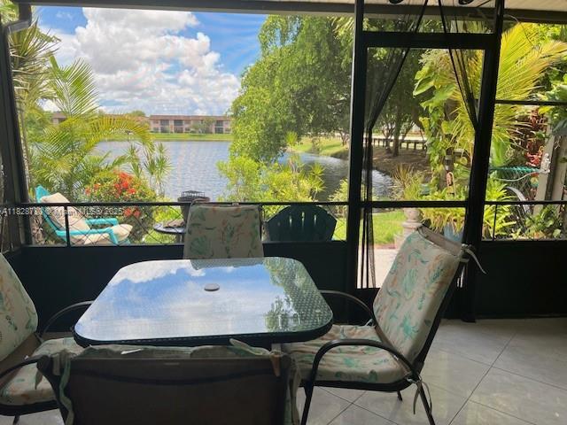 905 NW 107th Ave, Pembroke Pines, FL 33026 - sunroom / solarium featuring a water view