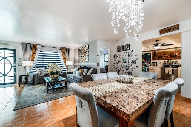 8065 W 14th Ct, Hialeah, FL 33014 - dining room featuring stairway, light tile patterned floors, and a ceiling fan