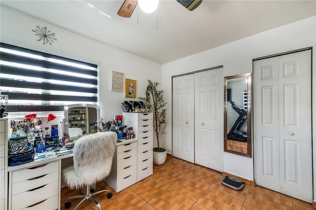 8065 W 14th Ct, Hialeah, FL 33014 - home office featuring light tile patterned floors, a ceiling fan, and built in study area