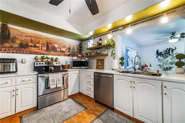 8065 W 14th Ct, Hialeah, FL 33014 - kitchen featuring appliances with stainless steel finishes, ceiling fan, decorative backsplash, open shelves, and white cabinetry