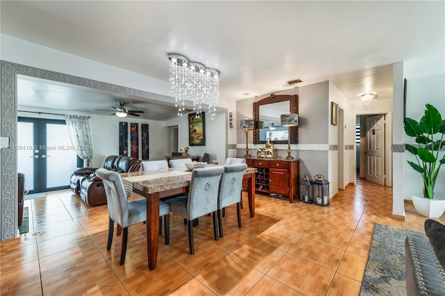 8065 W 14th Ct, Hialeah, FL 33014 - dining space featuring light tile patterned flooring, a chandelier, french doors, and ceiling fan