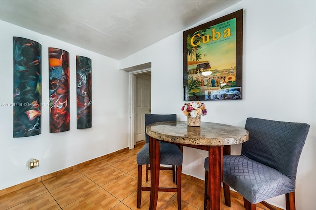 8065 W 14th Ct, Hialeah, FL 33014 - tiled dining room featuring baseboards