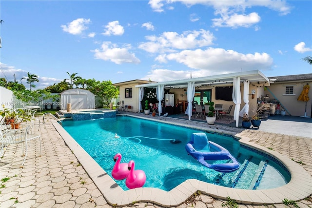 8065 W 14th Ct, Hialeah, FL 33014 - view of swimming pool featuring a patio area, a storage unit, and a pool with connected hot tub
