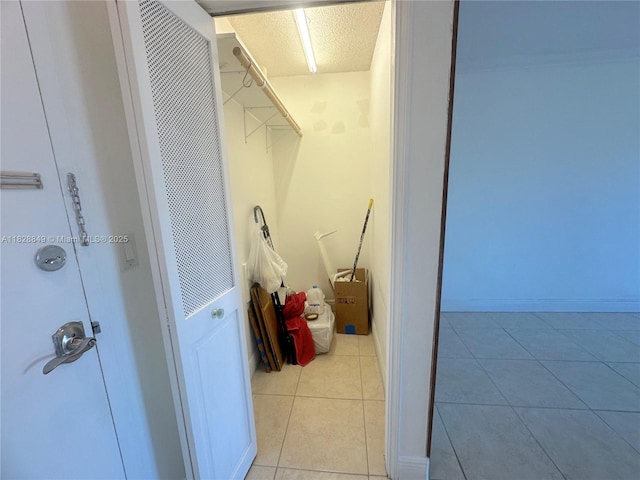 900 NE 18th Ave Unit 304, Fort Lauderdale, FL 33304 - laundry room featuring a heating unit and light tile patterned floors