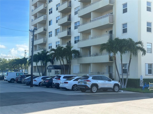 900 NE 18th Ave Unit 304, Fort Lauderdale, FL 33304 - view of apartment building / complex featuring uncovered parking