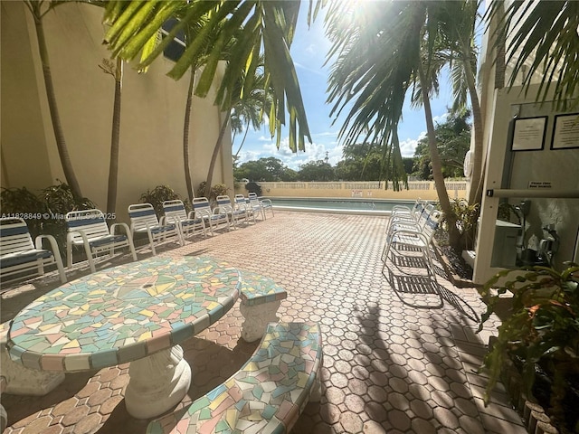 900 NE 18th Ave Unit 304, Fort Lauderdale, FL 33304 - view of patio with a community pool