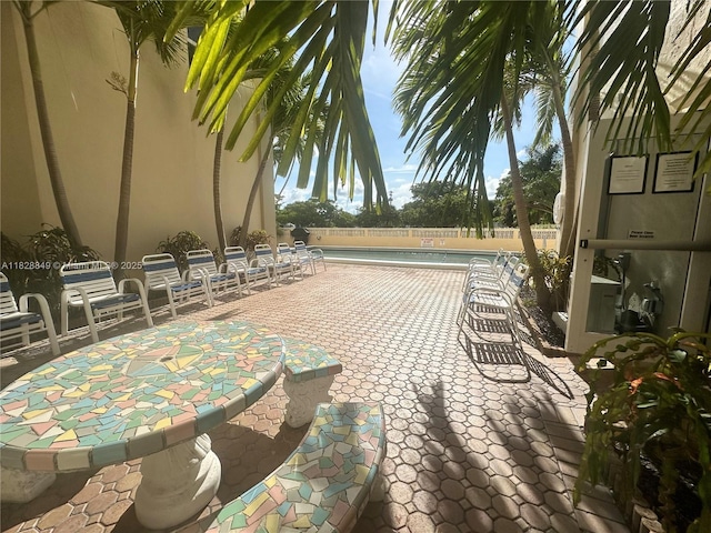 900 NE 18th Ave Unit 304, Fort Lauderdale, FL 33304 - view of patio / terrace with a community pool