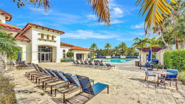 1601 SW 113th Ave, Pembroke Pines, FL 33025 - community pool featuring french doors and a patio area