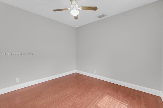 1592 Salerno Cir, Weston, FL 33327 - empty room featuring a ceiling fan and wood finished floors