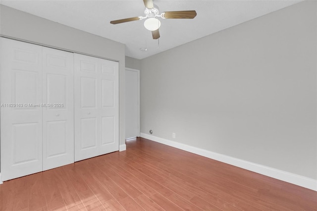 1592 Salerno Cir, Weston, FL 33327 - unfurnished bedroom with wood finished floors, a closet, and ceiling fan
