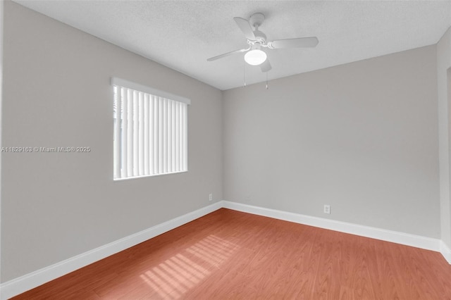 1592 Salerno Cir, Weston, FL 33327 - unfurnished room featuring a ceiling fan, wood finished floors, and a textured ceiling