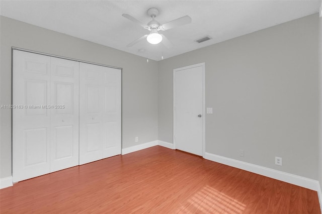 1592 Salerno Cir, Weston, FL 33327 - unfurnished bedroom featuring wood finished floors, a closet, and ceiling fan