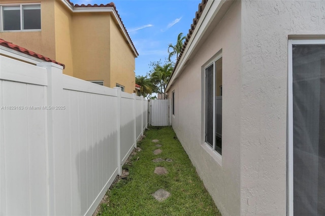 1592 Salerno Cir, Weston, FL 33327 - view of home's exterior with stucco siding and a tiled roof