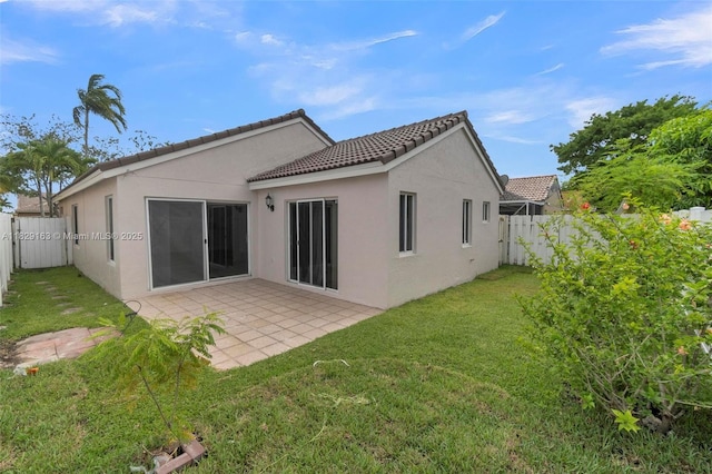 1592 Salerno Cir, Weston, FL 33327 - back of house featuring stucco siding, a fenced backyard, a patio, and a tiled roof