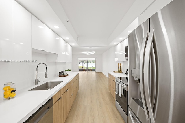 550 SW 138th Ave Unit 112K, Pembroke Pines, FL 33027 - kitchen featuring stainless steel appliances, modern cabinets, recessed lighting, light wood finished floors, and white cabinets