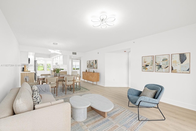 550 SW 138th Ave Unit 112K, Pembroke Pines, FL 33027 - living room with light wood-style floors and baseboards