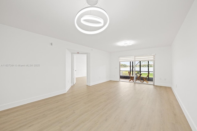 550 SW 138th Ave Unit 112K, Pembroke Pines, FL 33027 - unfurnished room with light wood-style floors and baseboards