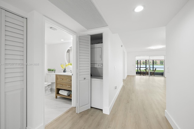 550 SW 138th Ave Unit 112K, Pembroke Pines, FL 33027 - hallway featuring estacked washer and dryer, light wood finished floors, and recessed lighting