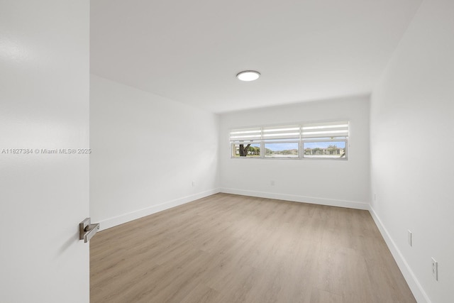 550 SW 138th Ave Unit 112K, Pembroke Pines, FL 33027 - spare room with light wood finished floors and baseboards