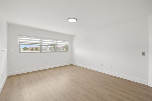 550 SW 138th Ave Unit 112K, Pembroke Pines, FL 33027 - spare room with wood finished floors and baseboards