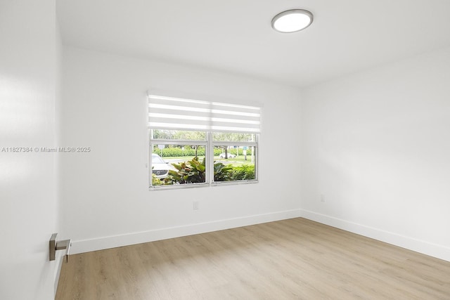 550 SW 138th Ave Unit 112K, Pembroke Pines, FL 33027 - spare room featuring wood finished floors and baseboards