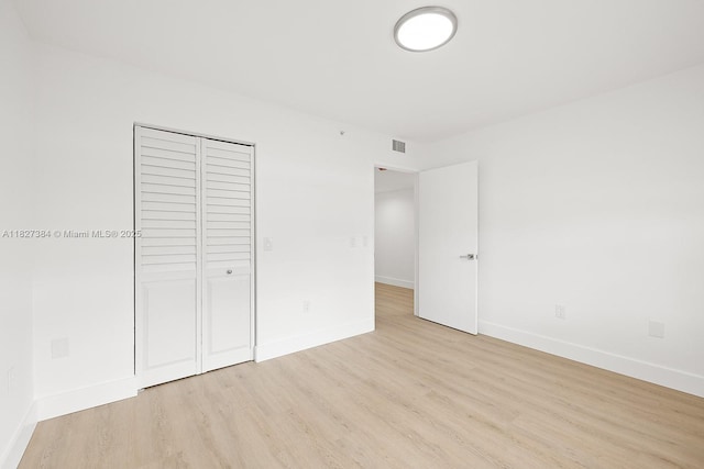 550 SW 138th Ave Unit 112K, Pembroke Pines, FL 33027 - unfurnished bedroom featuring light wood-style floors and a closet