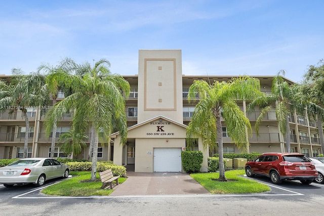 550 SW 138th Ave Unit 112K, Pembroke Pines, FL 33027 - view of apartment building / complex featuring a garage