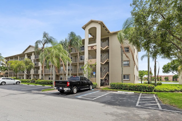 550 SW 138th Ave Unit 112K, Pembroke Pines, FL 33027 - view of apartment building / complex featuring uncovered parking