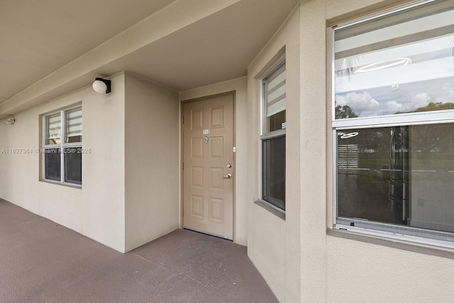 550 SW 138th Ave Unit 112K, Pembroke Pines, FL 33027 - doorway to property featuring stucco siding