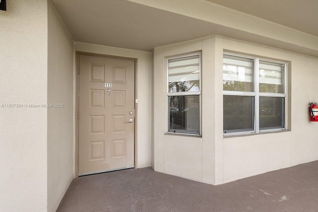 550 SW 138th Ave Unit 112K, Pembroke Pines, FL 33027 - view of exterior entry featuring stucco siding