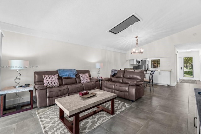 3693 N Arelia Dr N, Delray Beach, FL 33445 - living room featuring a chandelier and lofted ceiling