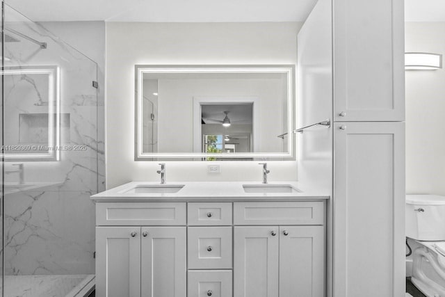 3693 N Arelia Dr N, Delray Beach, FL 33445 - bathroom with a marble finish shower and double vanity