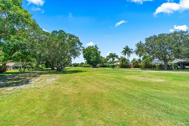 3693 N Arelia Dr N, Delray Beach, FL 33445 - view of property's community with a lawn